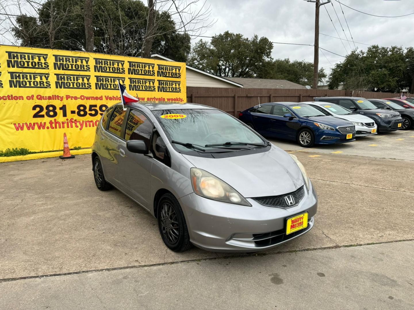 2009 Honda Fit 5-Speed AT (JHMGE882X9S) with an 1.5L L4 SOHC 16V engine, 5-Speed Automatic transmission, located at 16710 Clay Rd., Houston, TX, 77084, (281) 859-7900, 29.834864, -95.656166 - Photo#1